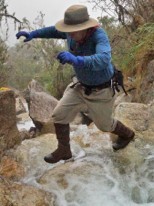 Gary Ziegler jumping over a creek