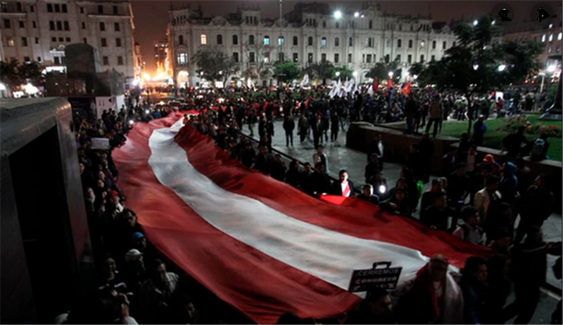 Crowds begin to gather in the Plaza San Martin Thursday night after the Congress shelved the early elections proposal.