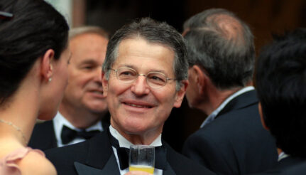 Honouring Emeritus Fellow Michael Kuczynski at the 2008 economists’ dinner at Pembroke College, Cambridge, surrounded by students and colleagues in the historic hall. Photo: Tony Jedrej.